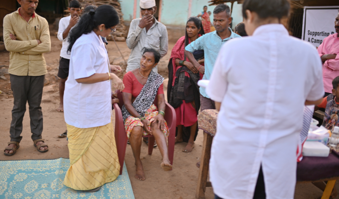 A health checkup is in progress where a woman is explaining the condition of her leg to the lady doctor